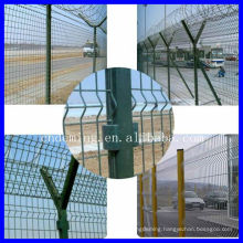 Airport security fence with Y post and barbed wire